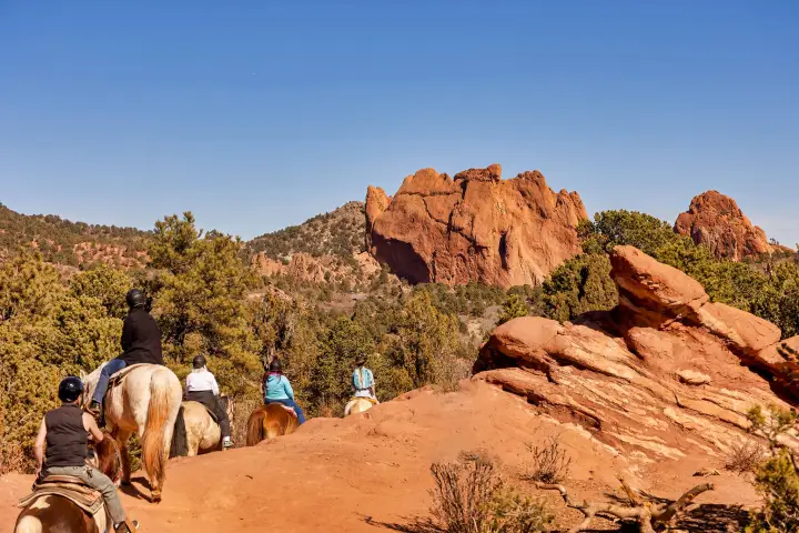 a group of people on a rocky hill